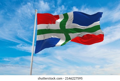 flag of Groningen , Netherlands at cloudy sky background on sunset, panoramic view. Dutch travel and patriot concept. copy space for wide banner. 3d illustration