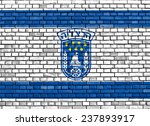 flag of Herzliya painted on brick wall