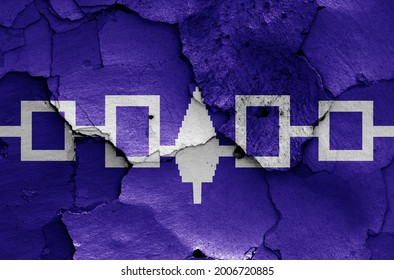 flag of Iroquois Confederacy painted on cracked wall