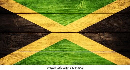 Flag Of Jamaica Or  Jamaican Banner On Wooden Background