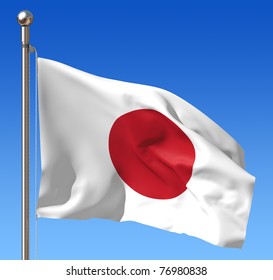Flag of Japan against blue sky.