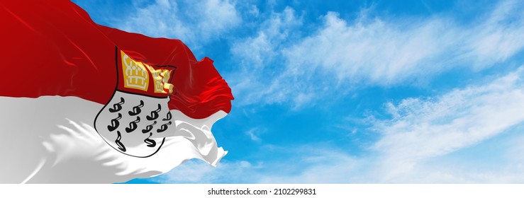 flag of Koln at cloudy sky background on sunset, panoramic view. Federal Republic of Germany. copy space for wide banner. 3d illustration