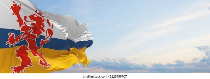 flag of Limburg , Netherlands at cloudy sky background on sunset, panoramic view. Dutch travel and patriot concept. copy space for wide banner. 3d illustration