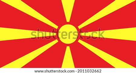The flag of North Macedonia is the national flag of the Republic of North Macedonia and depicts a stylized yellow sun on a red field, with eight broadening rays extending from the center to the edge o Foto stock © 