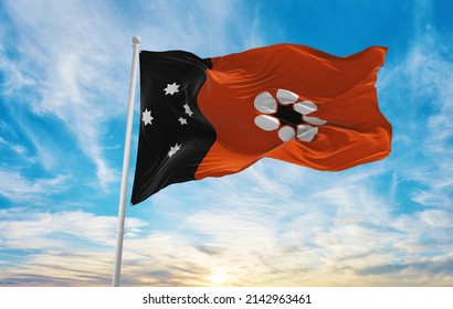 Flag Of Northern Territory , Australia At Cloudy Sky Background On Sunset, Panoramic View. Australian Travel And Patriot Concept. Copy Space For Wide Banner. 3d Illustration