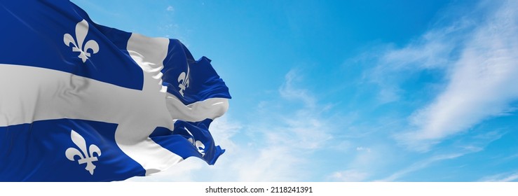flag of Quebec , Canada at cloudy sky background on sunset, panoramic view. Canadian travel and patriot concept. copy space for wide banner. 3d illustration