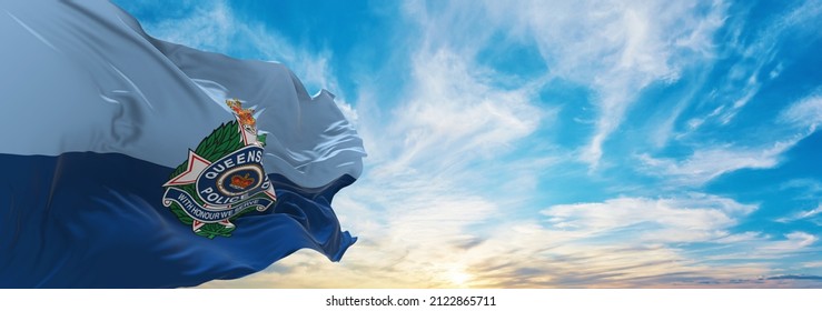 flag of Queensland Police Service , Australia at cloudy sky background on sunset, panoramic view. Australian travel and patriot concept. copy space for wide banner. 3d illustration