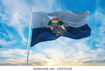 Flag Of Queensland Police Service , Australia At Cloudy Sky Background On Sunset, Panoramic View. Australian Travel And Patriot Concept. Copy Space For Wide Banner. 3d Illustration