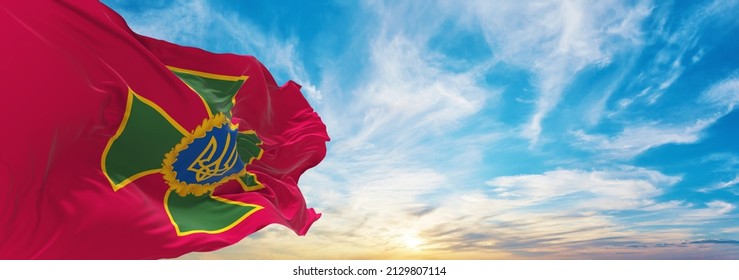 Flag Of State Border Guard Service , Ukraine At Cloudy Sky Background On Sunset, Panoramic View. Ukrainian Travel And Patriot Concept. Copy Space For Wide Banner. 3d Illustration