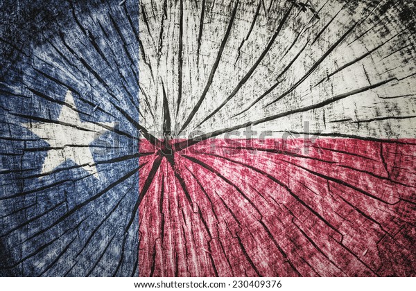 flag of  Texas on\
cracked wooden\
texture