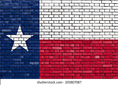 flag of Texas painted on brick wall