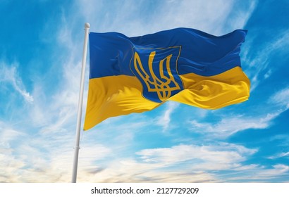 flag of Ukraine with coat of arms , Ukraine at cloudy sky background on sunset, panoramic view. Ukrainian travel and patriot concept. copy space for wide banner. 3d illustration
