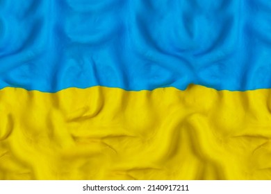 Flag of Ukraine made by hand with blue and yellow plasticine. Pray for Ukraine. Peace for Ukraine. Stop Ukraine war. Handmade from plasticine. 3D artwork