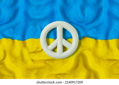 Flag of Ukraine with the symbol of peace. Pray for Ukraine. Stop Ukraine war. Peace for Ukraine. Handmade from plasticine. 3D artwork
