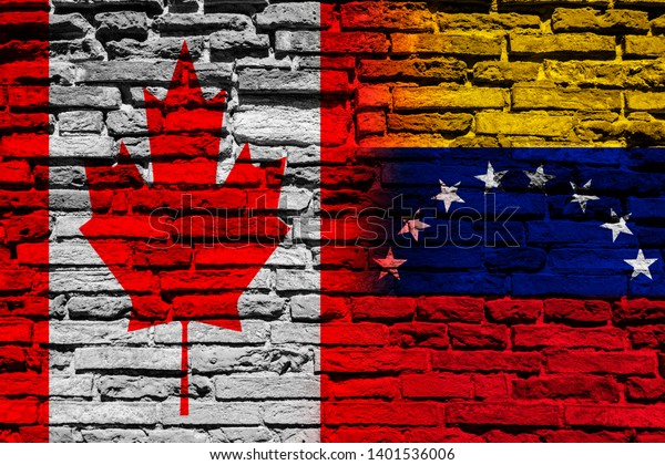Flag of Venezuela
and Canada on brick
wall