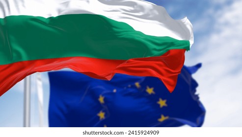 Flags of Bulgaria and the European Union waving in the wind on a clear day. Bulgaria became a member of the EU in January 2007. 3d illustration render. Fluttering textile. Selective focus - Powered by Shutterstock