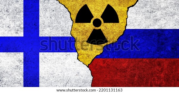 Flags of Finland, Russia and radiation symbol\
together. Russia and Finland Nuclear deal, threat, agreement,\
tensions concept