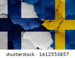 flags of Finland and Sweden painted on cracked wall