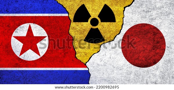 Flags of Japan, North Korea and radiation symbol\
together. Japan and North Korea Nuclear deal, threat, agreement,\
tensions concept