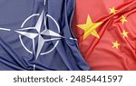 Flags of NATO and China lying side by side representing international relations, diplomacy and global geopolitical issues. 3D Rendering