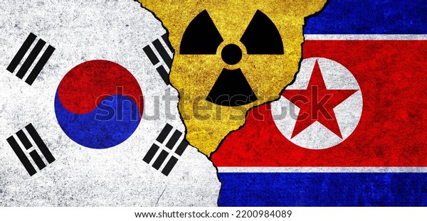 Flags of North Korea, South Korea and radiation\
symbol together. South Korea and North Korea Nuclear deal, threat,\
agreement, tensions\
concept