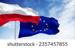 Flags of Poland and European Union waving together on a clear day. Poland has been a member of the EU since May 1, 2004. 3d illustration render. Fluttering fabric