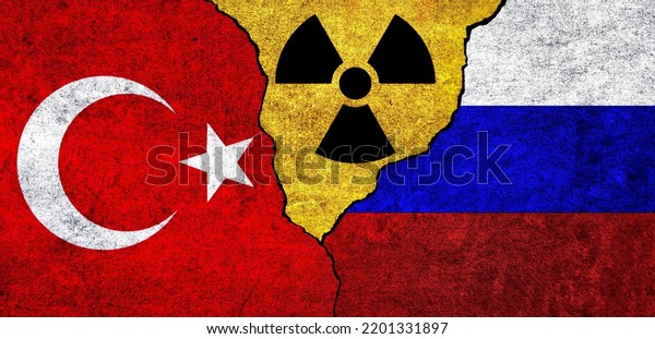 Flags\
of Turkey, Russia and radiation symbol together. Russia and Turkiye\
Nuclear deal, threat, agreement, tensions\
concept