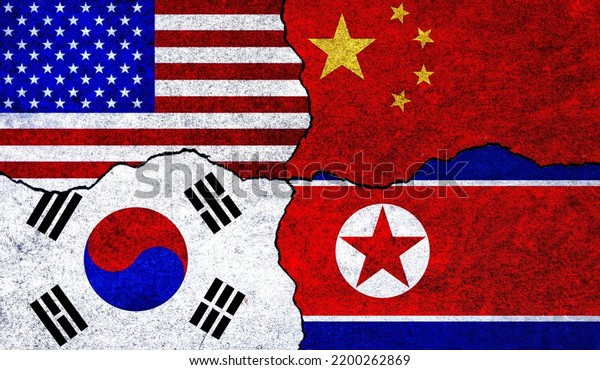 Flags\
of United States of America, China, South Korea and North Korea on\
a wall. China North Korea USA South Korea\
relations