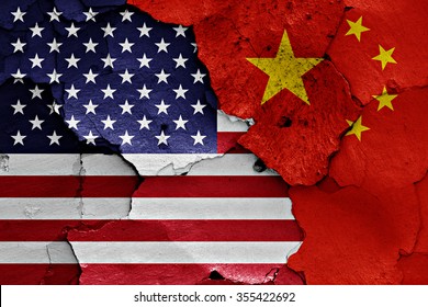 flags of USA and China painted on cracked wall
