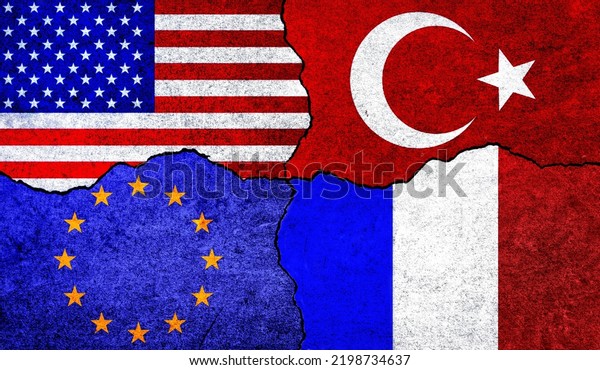 Flags of USA, France, EU and Turkey on a wall\
with crack. European Union, France, America and Turkey flags\
together. USA France Turkey EU\
relation