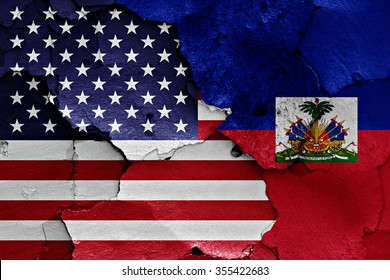 flags of USA and Haiti painted on cracked wall