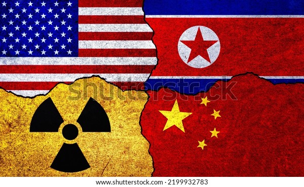 Flags of USA, North Korea, China and radiation\
symbol on a wall. United States of America, China and North Korea\
Nuclear Deal or Tensions\
concept