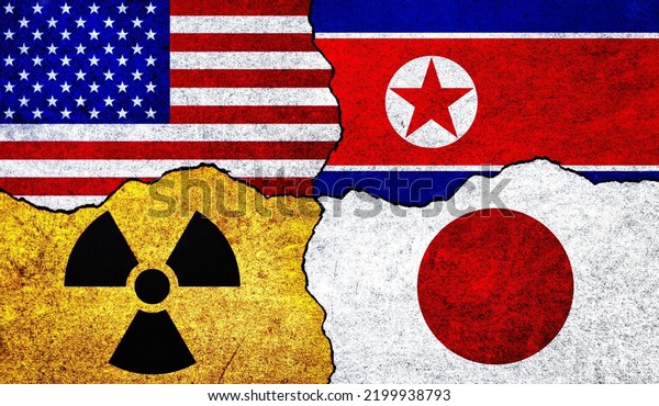 Flags of USA, North Korea, Japan and radiation\
symbol on a wall. United States of America, Japan and North Korea\
Nuclear Deal or Tensions\
concept