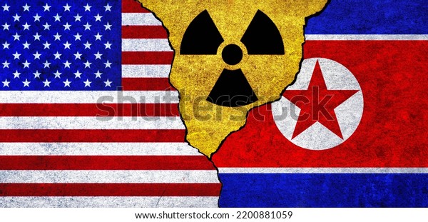 Flags of USA, North Korea and radiation symbol\
together. United States of America and North Korea Nuclear deal,\
threat, agreement, tensions\
concept