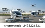 A fleet of generic white electric powered Vertical Take Off and Landing eVTOL aircraft with four rotors parked with airport buildings visible in the background. A passenger is boarding.