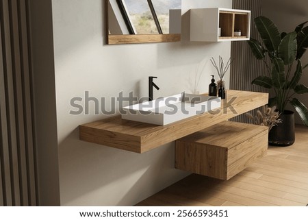 A floating wooden vanity with a rectangular white basin and a sleek black faucet. This modern bathroom design incorporates natural decor elements for a refined and functional aesthetic.