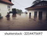 Flood water inundates homes as a river breaks its banks after very heavy downpours of rain for an extended period of time. Illustration.