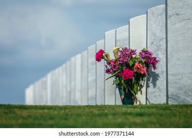 Flowers Left By Headstone To Honor A Patriot In A National Cemetery. (All Identifiers Digitally Removed.) Digital Oil-painting Effect, 3D Rendering.