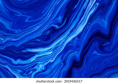 Fluid Art Texture. Abstract Backdrop With Mixing Paint Effect. Liquid Acrylic Picture That Flows And Splashes. Classic Blue Color Of The Year 2020. Blue, White And Indigo Overflowing Colors.