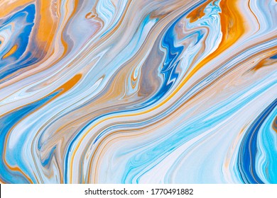 Fluid art texture. Background with abstract mixing paint effect. Liquid acrylic picture that flows and splashes. Mixed paints for interior poster. Blue, orange and azure overflowing colors