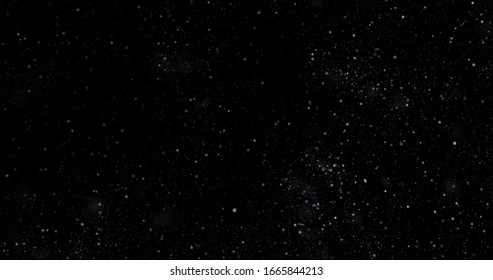 Flying Dust Particles On A Black Background