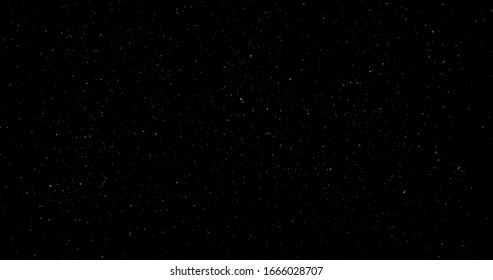 Flying Dust Particles On A Black Background