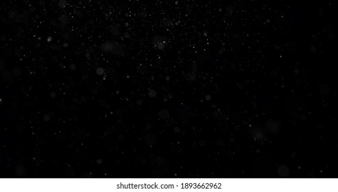 Flying Dust Particles On A Black Background