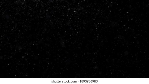 Flying Dust Particles On A Black Background