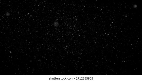 Flying Dust Particles On A Black Background