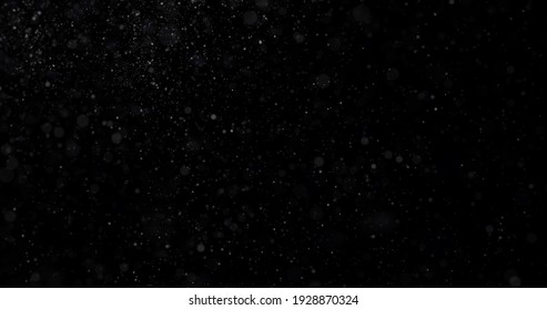 Flying Dust Particles On A Black Background