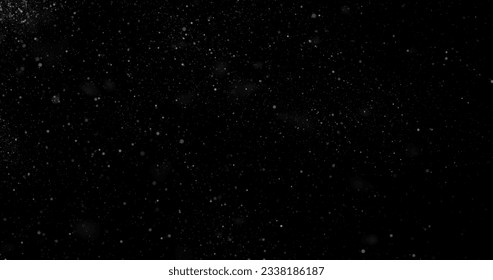 Flying dust particles on a black background - Shutterstock ID 2338186187