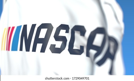 Flying flag with Nascar team logo, close-up. Editorial 3D rendering
