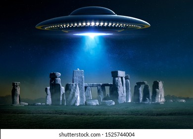 Flying Saucer over Stonehenge ancient archaeological place with light ray in a misty night - 3D rendering and photo manipulation 