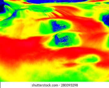 Foamy water level of waterfall, curves between boulders of rapids. Cold water of mountain river in infrared photo. Amazing thermography. 